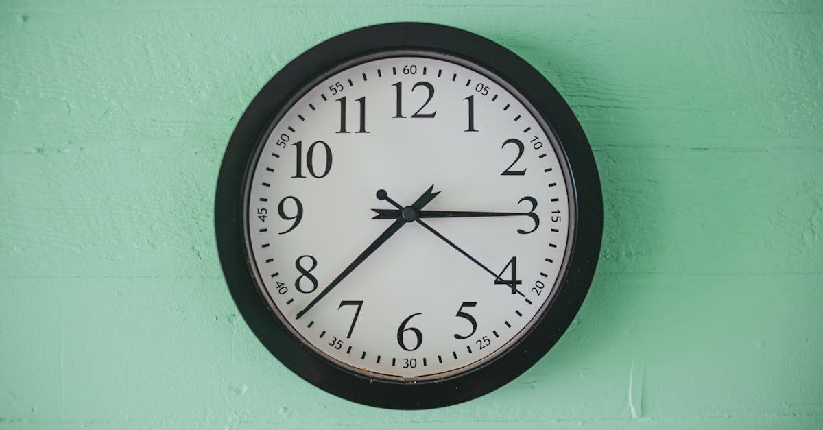 Calendar with holiday dates highlighted and a small potted plant on a desk