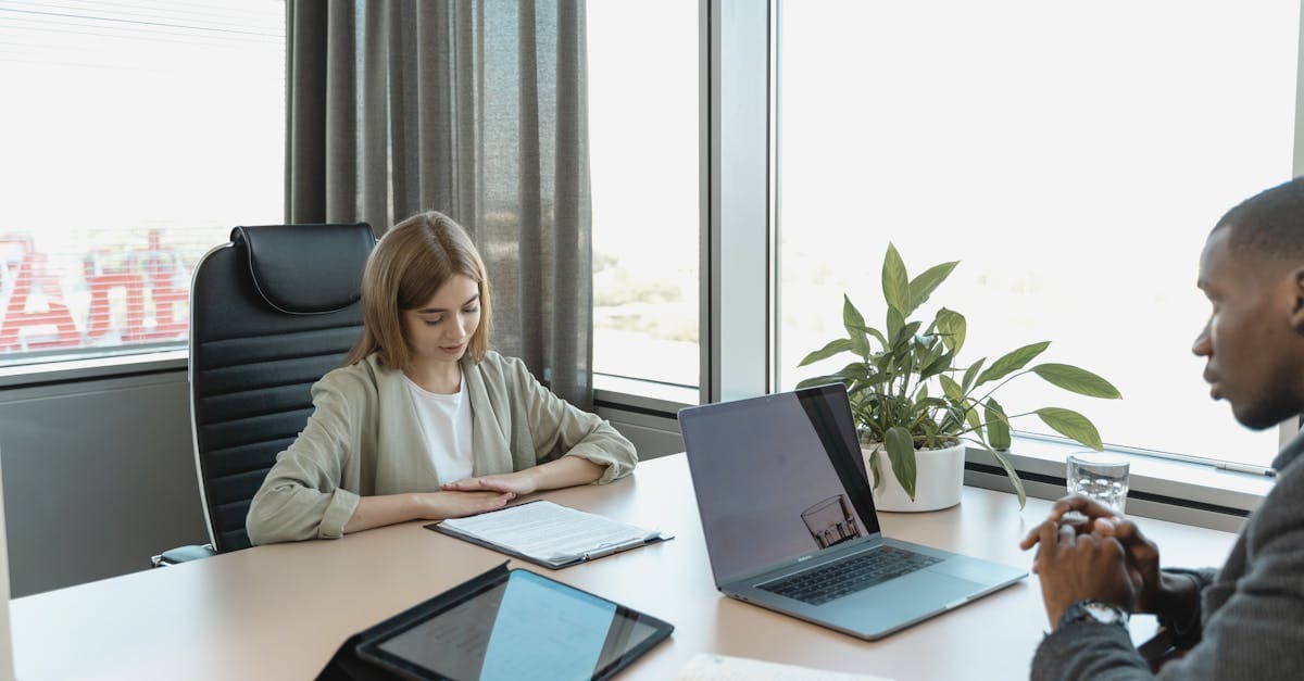 Small business owner comparing pension provider options on screen