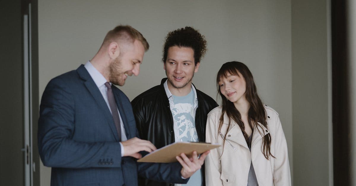 Estate agent presenting portfolio data to a prospective landlord