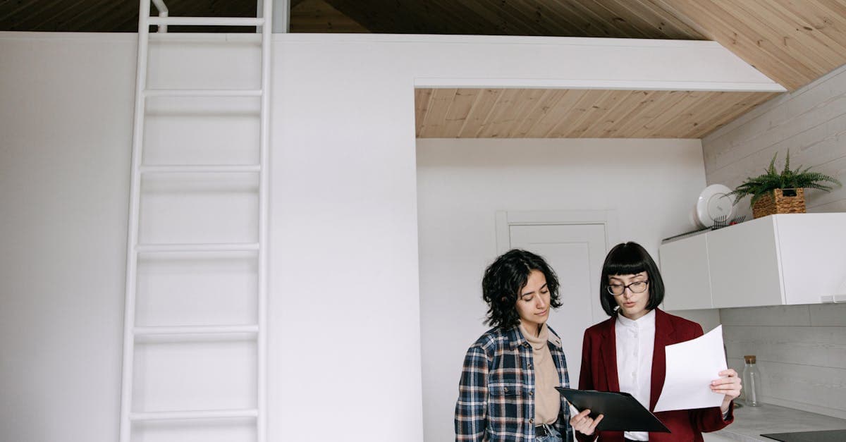 Small business owner reviewing customer retention data on laptop