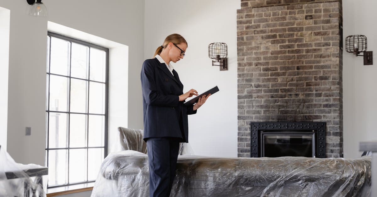 Inventory clerk using a tablet with digital inventory software at a rental property
