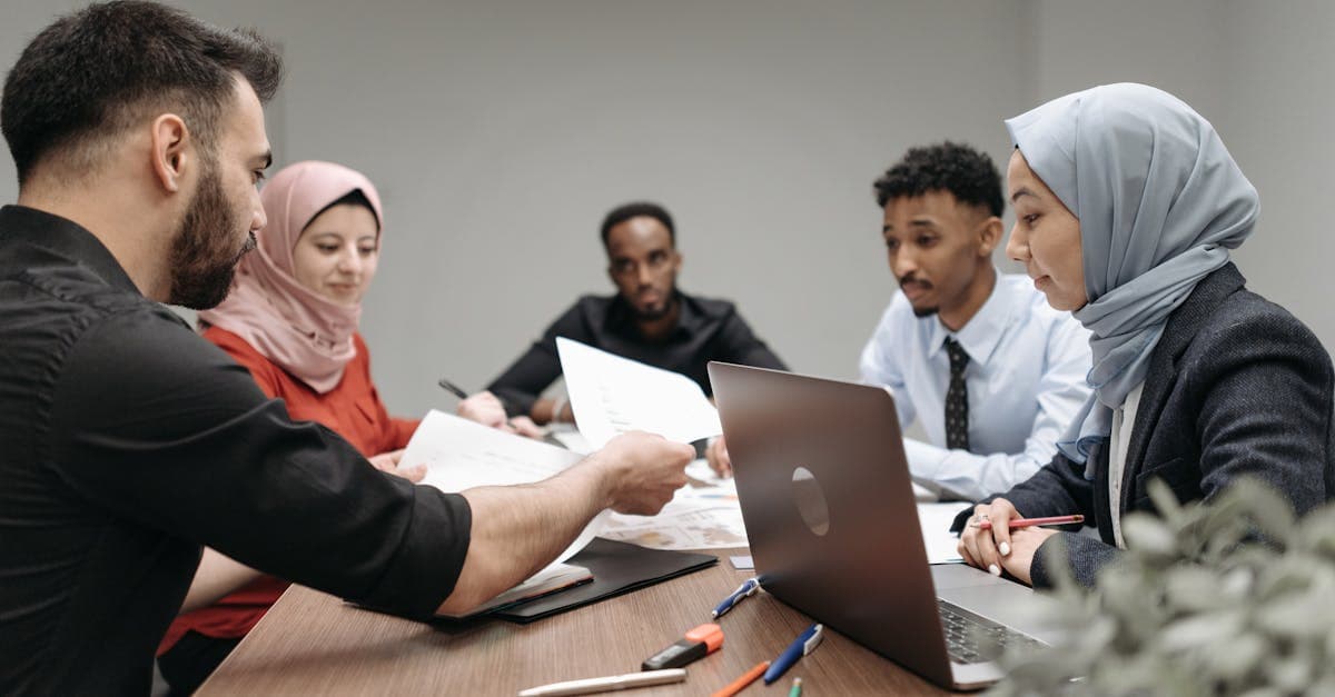 Insurance policy document with a pen on a wooden desk