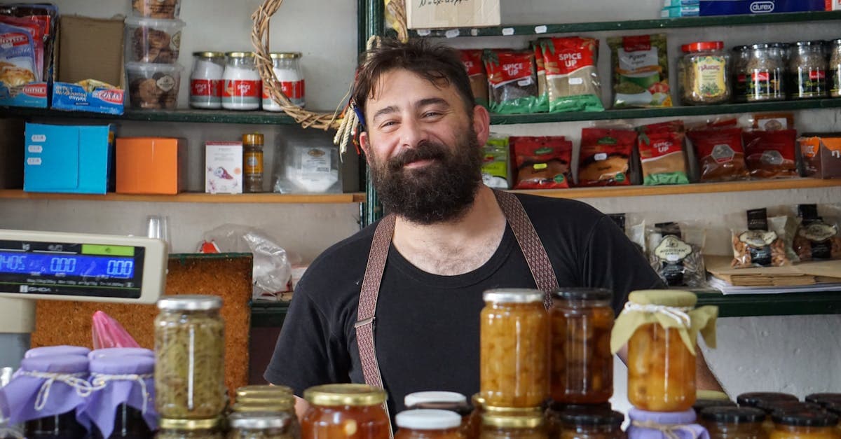 Business owner reading a grant application document at a desk