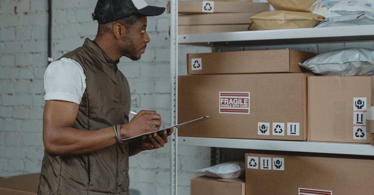 Inventory clerk writing detailed condition notes on a tablet during a property inspection