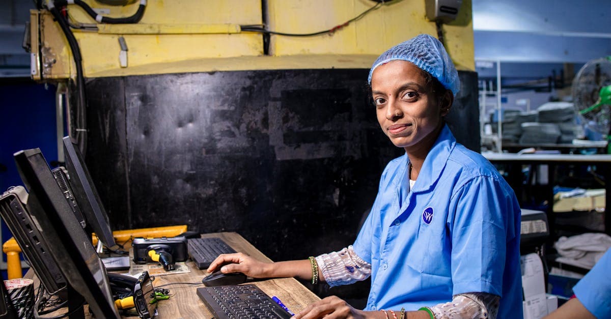 Security guard in uniform checking a mobile device outside a commercial building