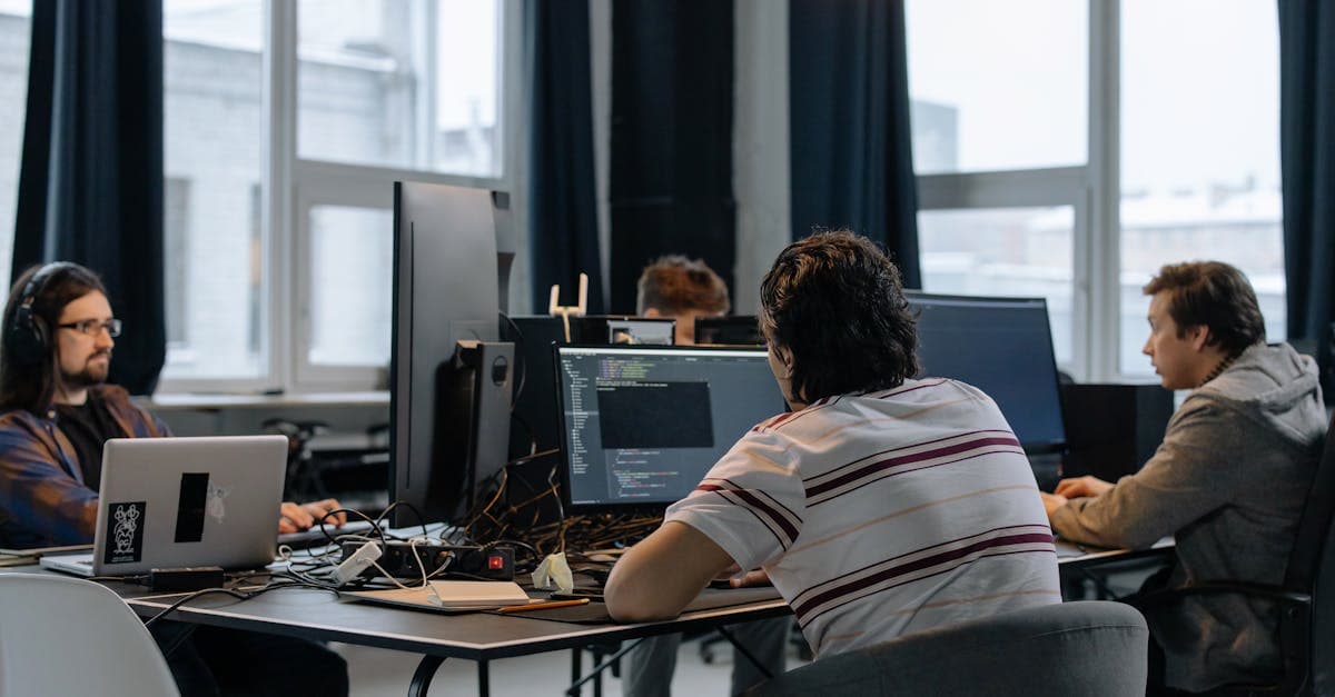 Calendar with highlighted leave dates on a desk beside a laptop