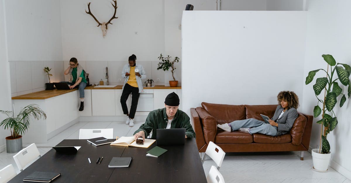 Home office setup with laptop, monitor, and desk lamp