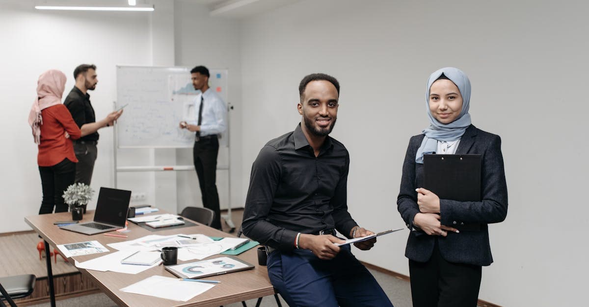 Business owner reviewing pension documents with a financial adviser