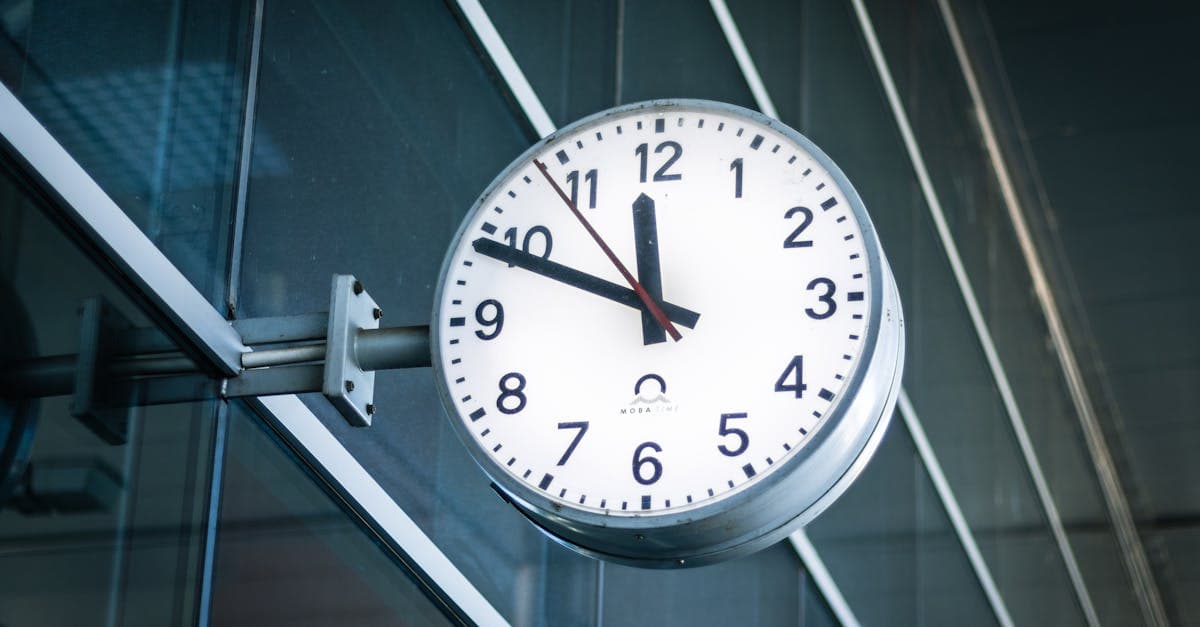Restaurant kitchen with staff in aprons preparing food during a busy service