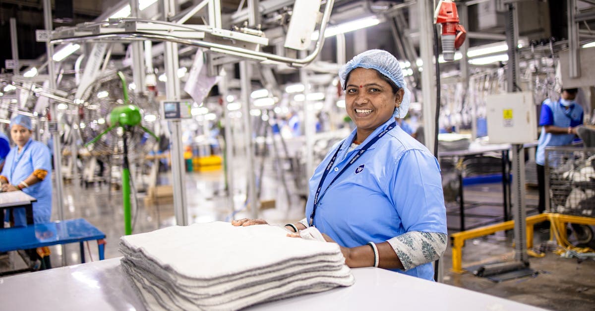 Small business owner configuring a timesheet system on a laptop