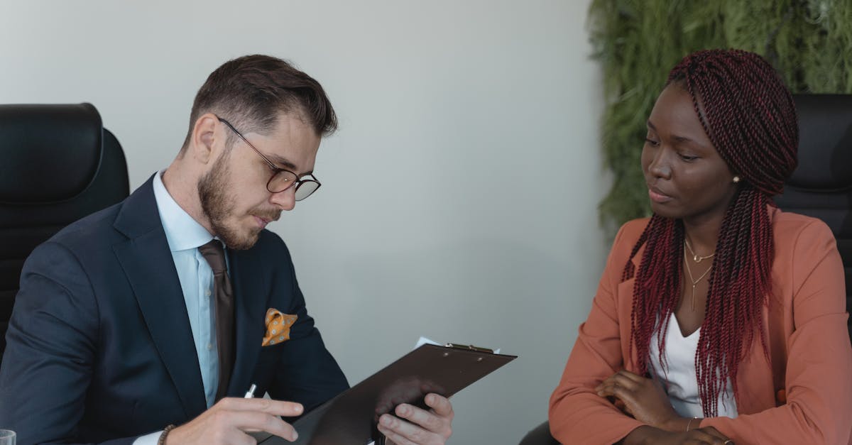 Small business owner reviewing payroll documents at a desk