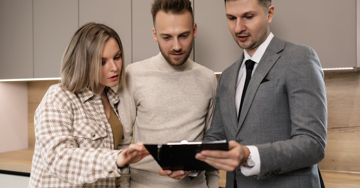 Architecture firm team reviewing client project details on a digital dashboard