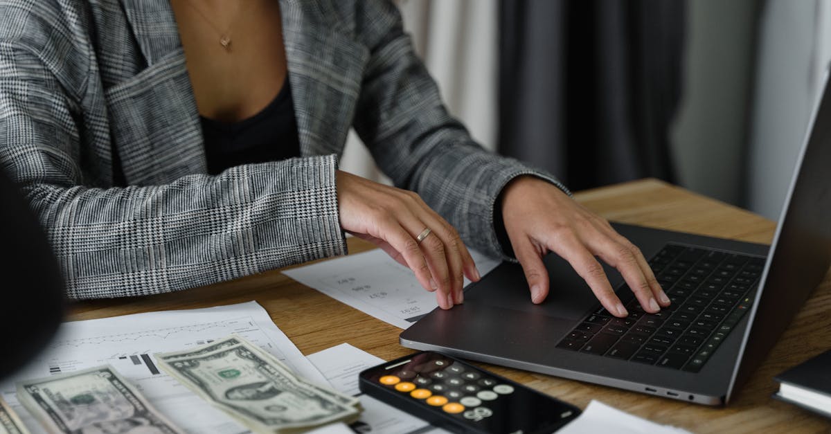 US payroll tax form and calculator on a desk