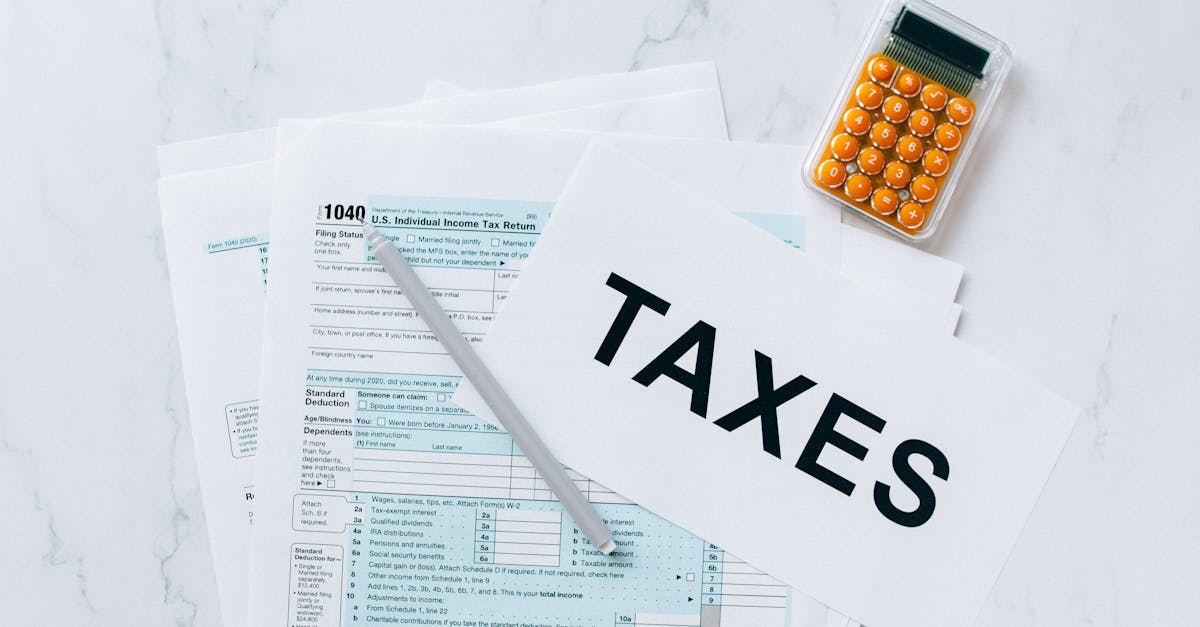 Sole trader reviewing tax documents at a desk