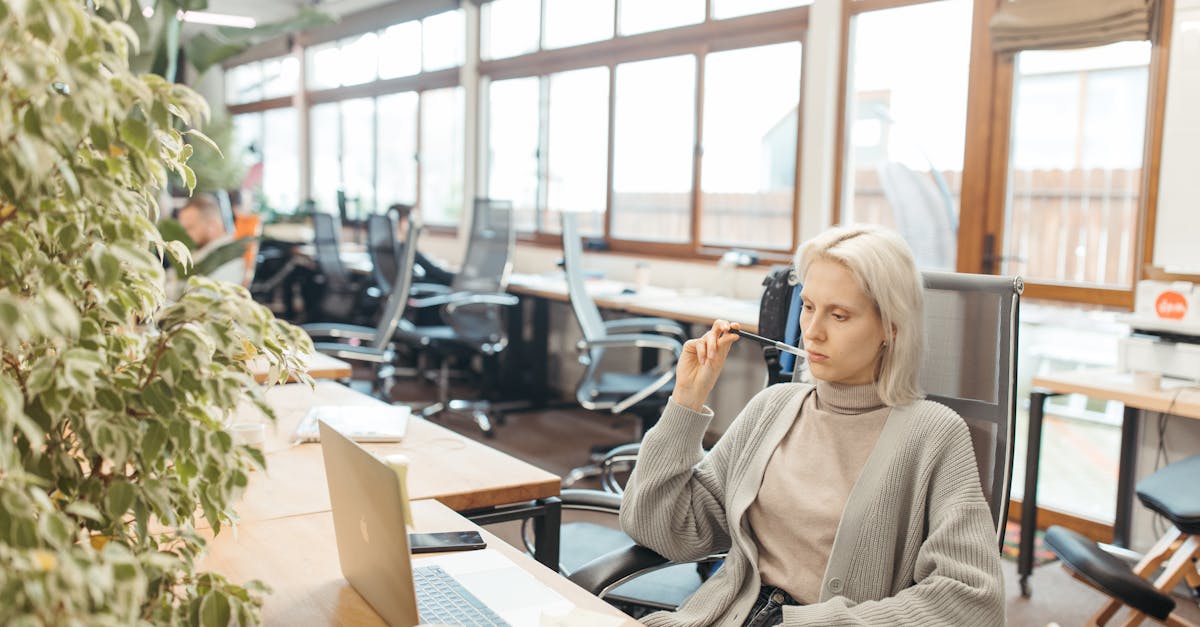 Business owner reviewing financial documents and calculator at desk