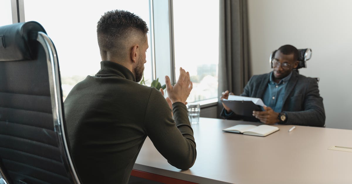 Hiring manager writing a job description on a computer